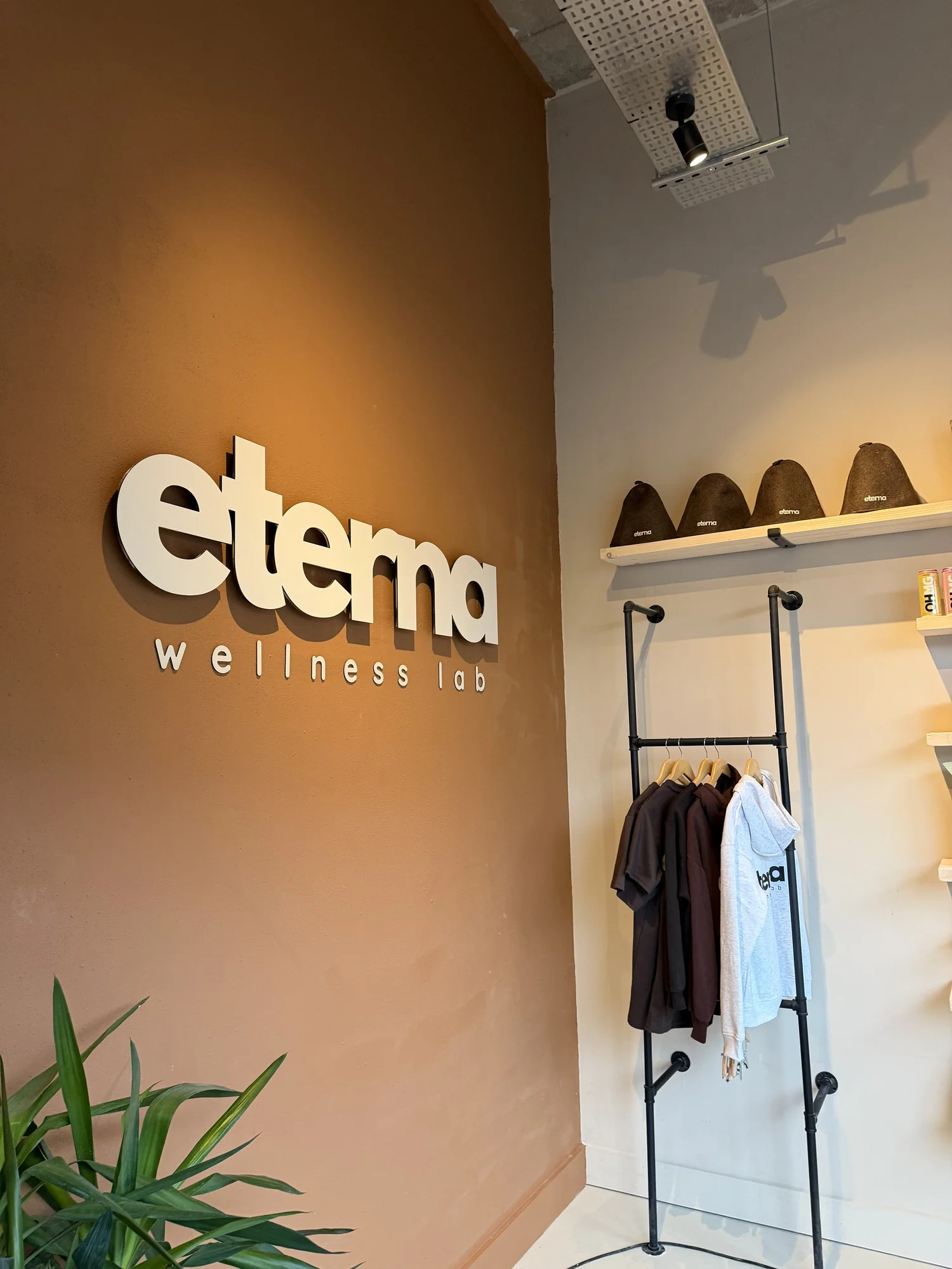 Eterna Wellness Lab interior with illuminated logo wall